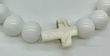 Cross bracelet with white beads