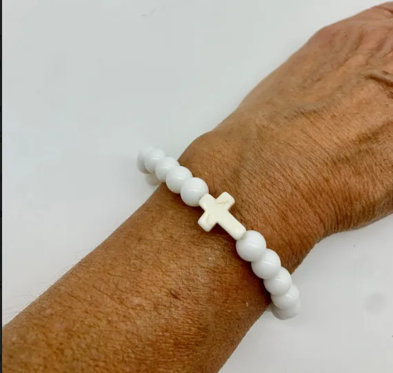 Cross bracelet with white beads